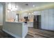 Modern kitchen with stainless steel appliances and granite countertops at 16122 Cedar Key Dr, Wimauma, FL 33598