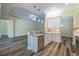 Modern kitchen with stainless steel appliances and granite countertops at 16122 Cedar Key Dr, Wimauma, FL 33598