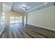 Living room with pool view and sliding doors at 16122 Cedar Key Dr, Wimauma, FL 33598