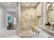 Spacious bathroom with a large walk-in shower and marble walls at 16220 Villarreal De Avila, Tampa, FL 33613