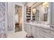 Luxury bathroom with marble countertops and built-in shelving at 16220 Villarreal De Avila, Tampa, FL 33613