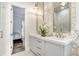 Bathroom with a double vanity, gold accents, and geometric tile at 16220 Villarreal De Avila, Tampa, FL 33613