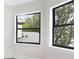 Bedroom with large windows offering ample natural light at 16220 Villarreal De Avila, Tampa, FL 33613