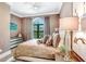 Comfortable bedroom with a king-size bed and large window at 16220 Villarreal De Avila, Tampa, FL 33613