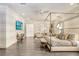 Main bedroom with a four-poster bed, sitting area, and hardwood floors at 16220 Villarreal De Avila, Tampa, FL 33613
