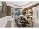 Formal dining room with a large table, chandelier, and dark-brown walls at 16220 Villarreal De Avila, Tampa, FL 33613