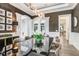 Elegant dining room with a large table and a statement chandelier at 16220 Villarreal De Avila, Tampa, FL 33613