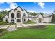 Elegant two-story home with a large driveway and landscaping at 16220 Villarreal De Avila, Tampa, FL 33613