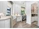 Bright laundry room with custom cabinetry and built-in shelving at 16220 Villarreal De Avila, Tampa, FL 33613