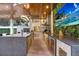 Long outdoor kitchen with two islands and high-end appliances at 16220 Villarreal De Avila, Tampa, FL 33613