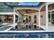 Covered patio with seating area and water feature at 16220 Villarreal De Avila, Tampa, FL 33613
