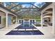 Resort-style pool with covered patio and lounging areas at 16220 Villarreal De Avila, Tampa, FL 33613