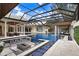 Expansive pool with a unique design and multiple seating areas at 16220 Villarreal De Avila, Tampa, FL 33613