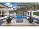 Resort-style pool with a fire pit and lush landscaping at 16220 Villarreal De Avila, Tampa, FL 33613