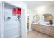 Modern bathroom with a double vanity and walk-in closet at 180 Water Oak Way, Oldsmar, FL 34677