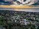 Aerial view of residential neighborhood near the coast at sunset at 1825 San Mateo Dr, Dunedin, FL 34698