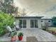 Large backyard with patio and garden area, offering ample outdoor space at 1825 San Mateo Dr, Dunedin, FL 34698