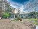 Extensive backyard with garden and patio, offering a tranquil outdoor area at 1825 San Mateo Dr, Dunedin, FL 34698