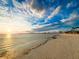 Peaceful beach scene at sunset with clear sky and calm waters at 1825 San Mateo Dr, Dunedin, FL 34698
