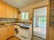 Bright kitchen with granite countertops and white appliances at 1825 San Mateo Dr, Dunedin, FL 34698