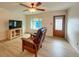 Living room with hardwood floors, comfortable seating, and TV at 1825 San Mateo Dr, Dunedin, FL 34698