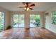 Spacious sunroom with sliding glass doors and view of backyard at 1825 San Mateo Dr, Dunedin, FL 34698
