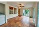 Bright sunroom with tile floors, access to backyard, and ceiling fan at 1825 San Mateo Dr, Dunedin, FL 34698