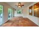 Sunroom with tile floors and sliding glass doors leading to patio at 1825 San Mateo Dr, Dunedin, FL 34698