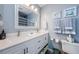Clean bathroom with double vanity and updated fixtures at 1855 Bough Ave # B, Clearwater, FL 33760