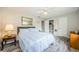 Bright bedroom with a comfortable bed and plenty of closet space at 1855 Bough Ave # B, Clearwater, FL 33760