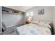 Charming bedroom with floral bedding and good closet space at 1855 Bough Ave # B, Clearwater, FL 33760