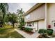 Inviting exterior of condo with landscaped grounds at 1855 Bough Ave # B, Clearwater, FL 33760