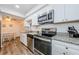 Well-equipped kitchen featuring granite countertops at 1855 Bough Ave # B, Clearwater, FL 33760