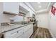 Modern kitchen with white cabinets and stainless steel appliances at 1855 Bough Ave # B, Clearwater, FL 33760