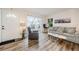 Living room with hardwood floors and access to patio at 1855 Bough Ave # B, Clearwater, FL 33760