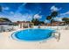 Community swimming pool with a relaxing patio area at 1855 Bough Ave # B, Clearwater, FL 33760