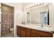 Bathroom boasts double sinks and wood cabinets at 2135 Park Crescent Dr, Land O Lakes, FL 34639
