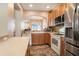 Well-equipped kitchen with stainless steel appliances and light wood cabinets at 2135 Park Crescent Dr, Land O Lakes, FL 34639