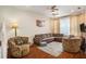 Spacious living room with comfortable seating and hardwood flooring at 2135 Park Crescent Dr, Land O Lakes, FL 34639