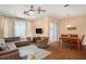 Spacious living room features a comfortable sectional sofa and adjacent dining area at 2135 Park Crescent Dr, Land O Lakes, FL 34639