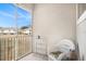 Relaxing screened porch with white wicker chair and view at 2135 Park Crescent Dr, Land O Lakes, FL 34639