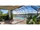 Enclosed pool and spa with a view of the lake at 25622 Ferdinand Ct, Wesley Chapel, FL 33544