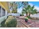 Landscaped backyard with patio and raised garden beds at 2589 Redwood Cir, Clearwater, FL 33763