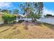 Large backyard with a privacy fence and established trees at 2589 Redwood Cir, Clearwater, FL 33763