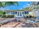 Relaxing patio area with table, chairs, and lounge chairs at 2589 Redwood Cir, Clearwater, FL 33763