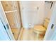 Small bathroom with shower and beige tile at 2589 Redwood Cir, Clearwater, FL 33763
