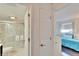 Clean bathroom with shower and white tile at 2589 Redwood Cir, Clearwater, FL 33763