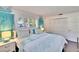 Spacious bedroom with a king-size bed and white dresser at 2589 Redwood Cir, Clearwater, FL 33763