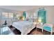 Bright bedroom with a king-size bed and coastal decor at 2589 Redwood Cir, Clearwater, FL 33763