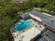 Arial view of community pool with surrounding lounge chairs and patio area at 2589 Redwood Cir, Clearwater, FL 33763